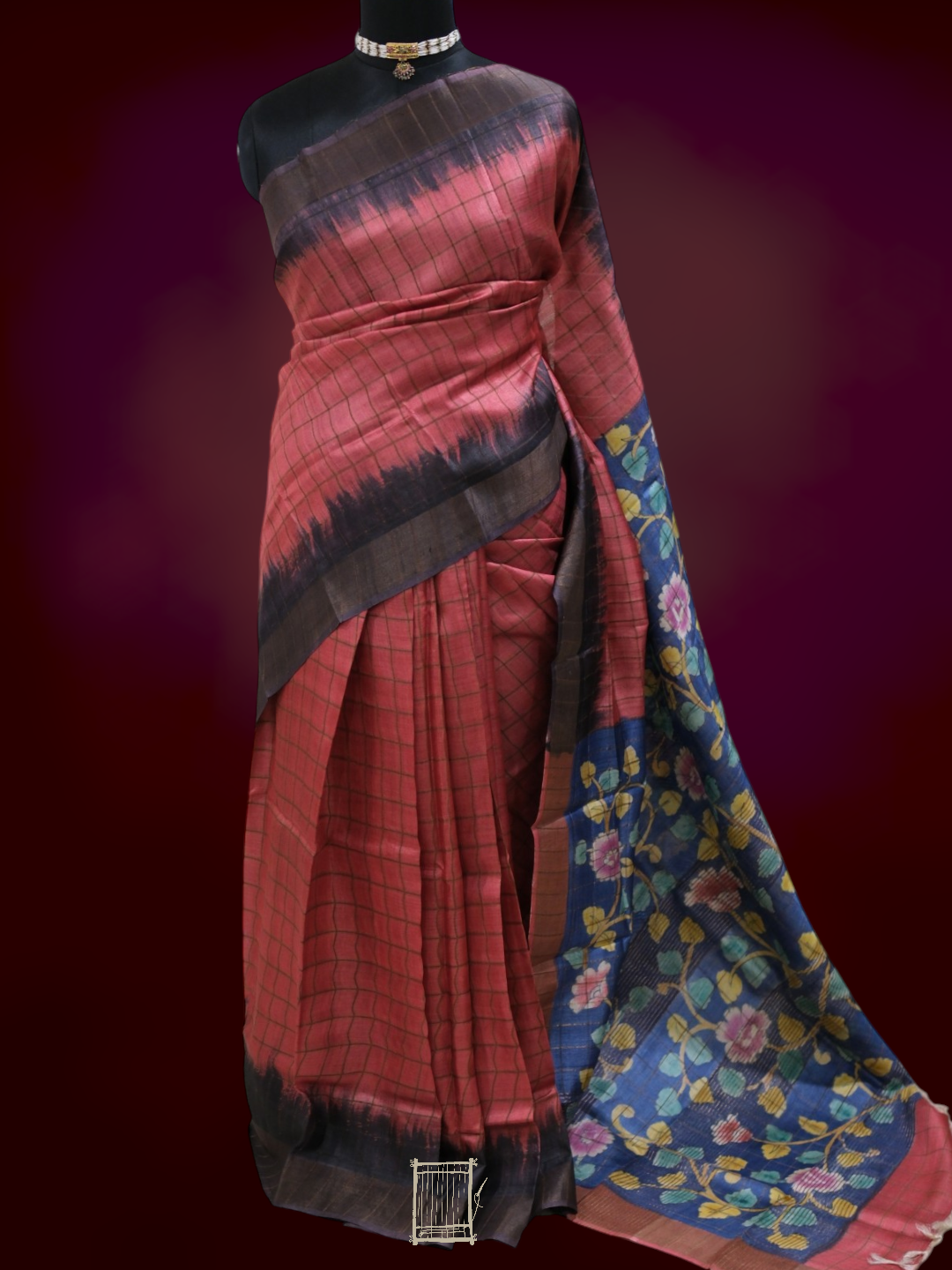 Full drape of coral tussar saree with indigo kalamkari pallu, front view on mannequin