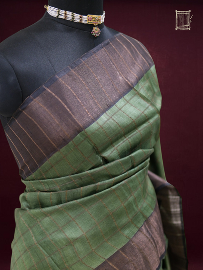 Top bust drape of forest green tussar saree with charcoal-bronze border