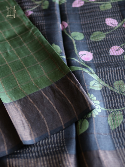 Forest green tussar body with copper checks beside charcoal kalamkari pallu with pink leaf vine