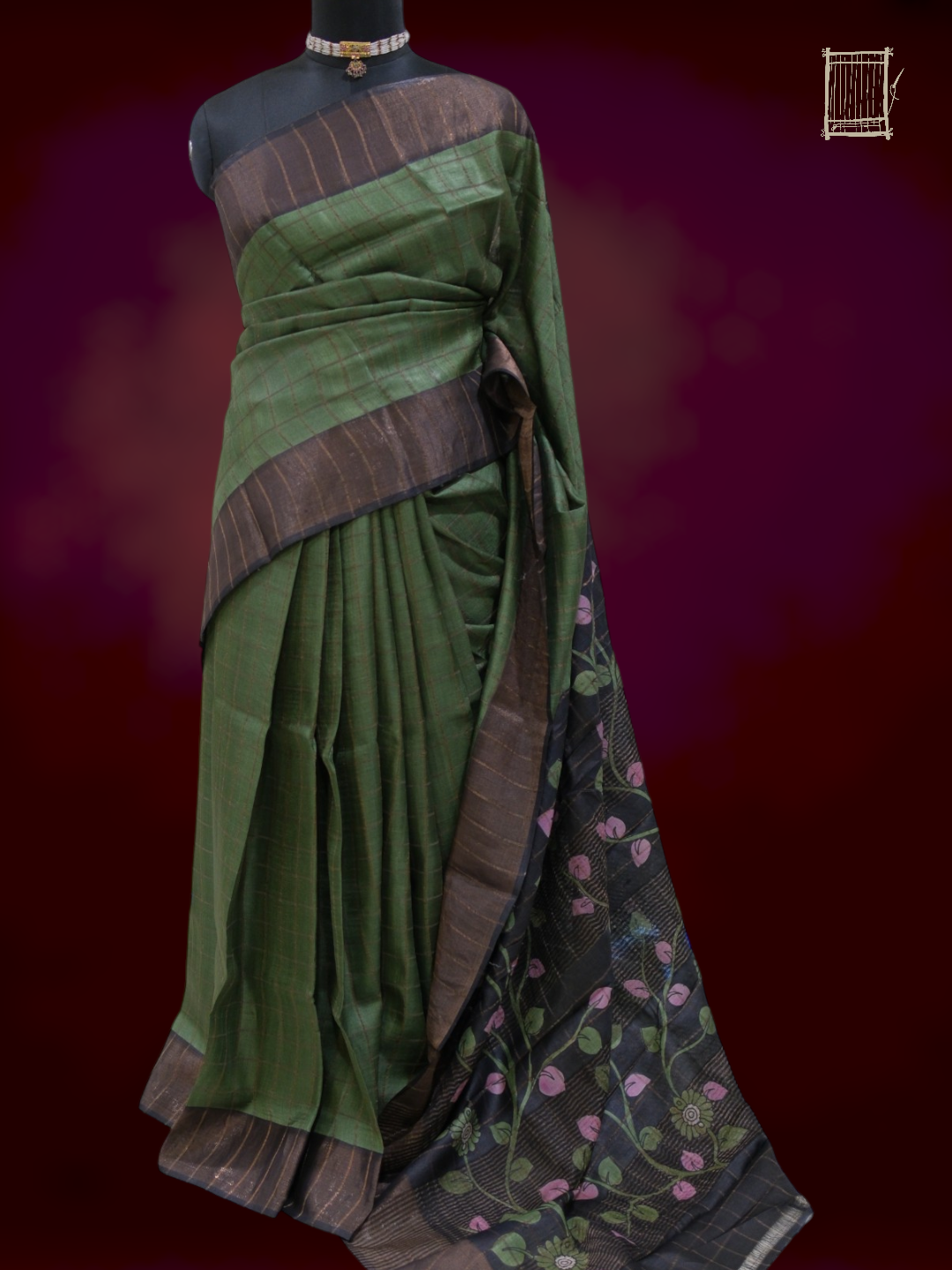 Full drape of forest green tussar saree with charcoal kalamkari pallu on mannequin, front view