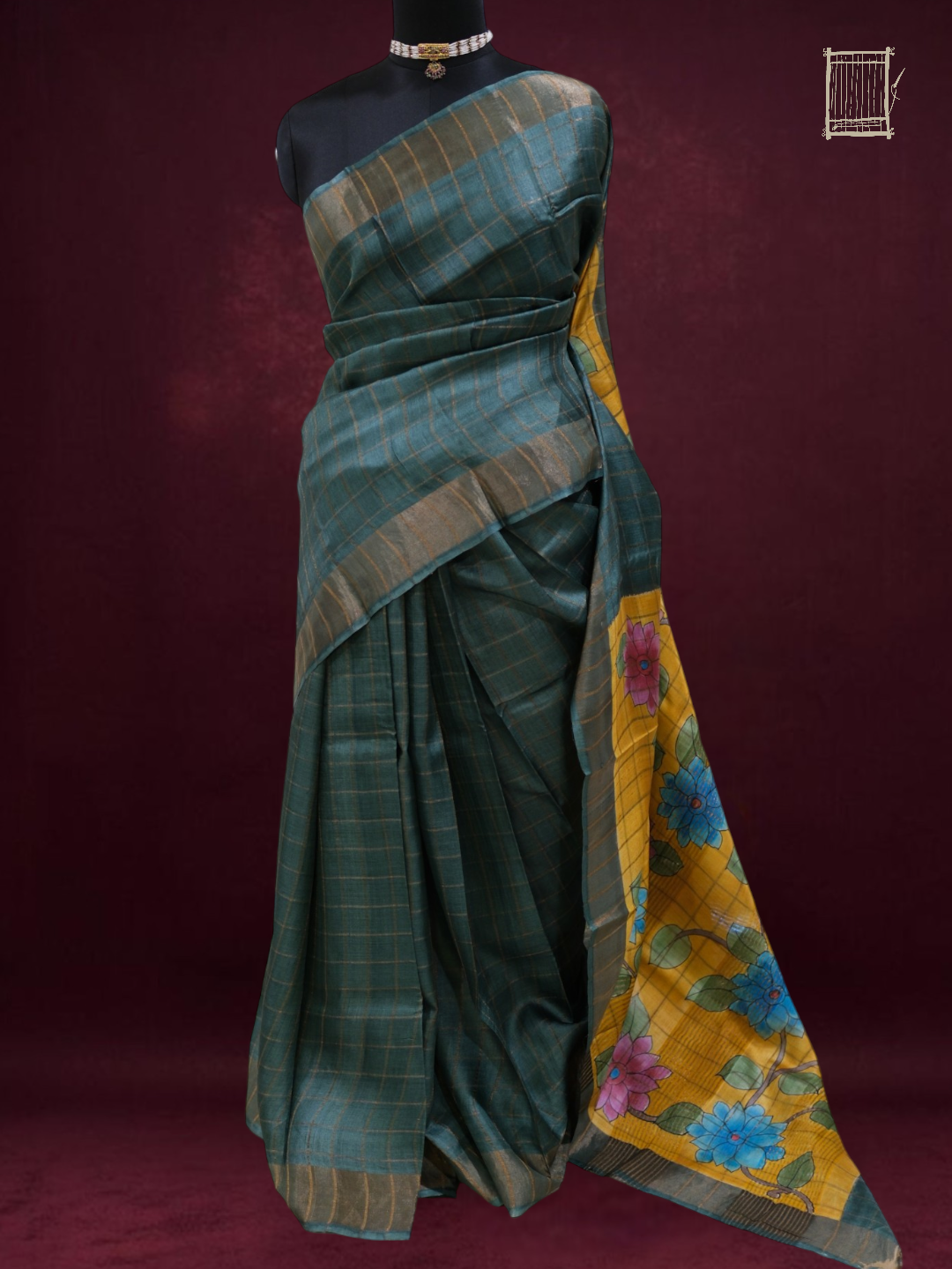 Full mannequin drape of sea teal tussar saree with mustard kalamkari pallu, front view