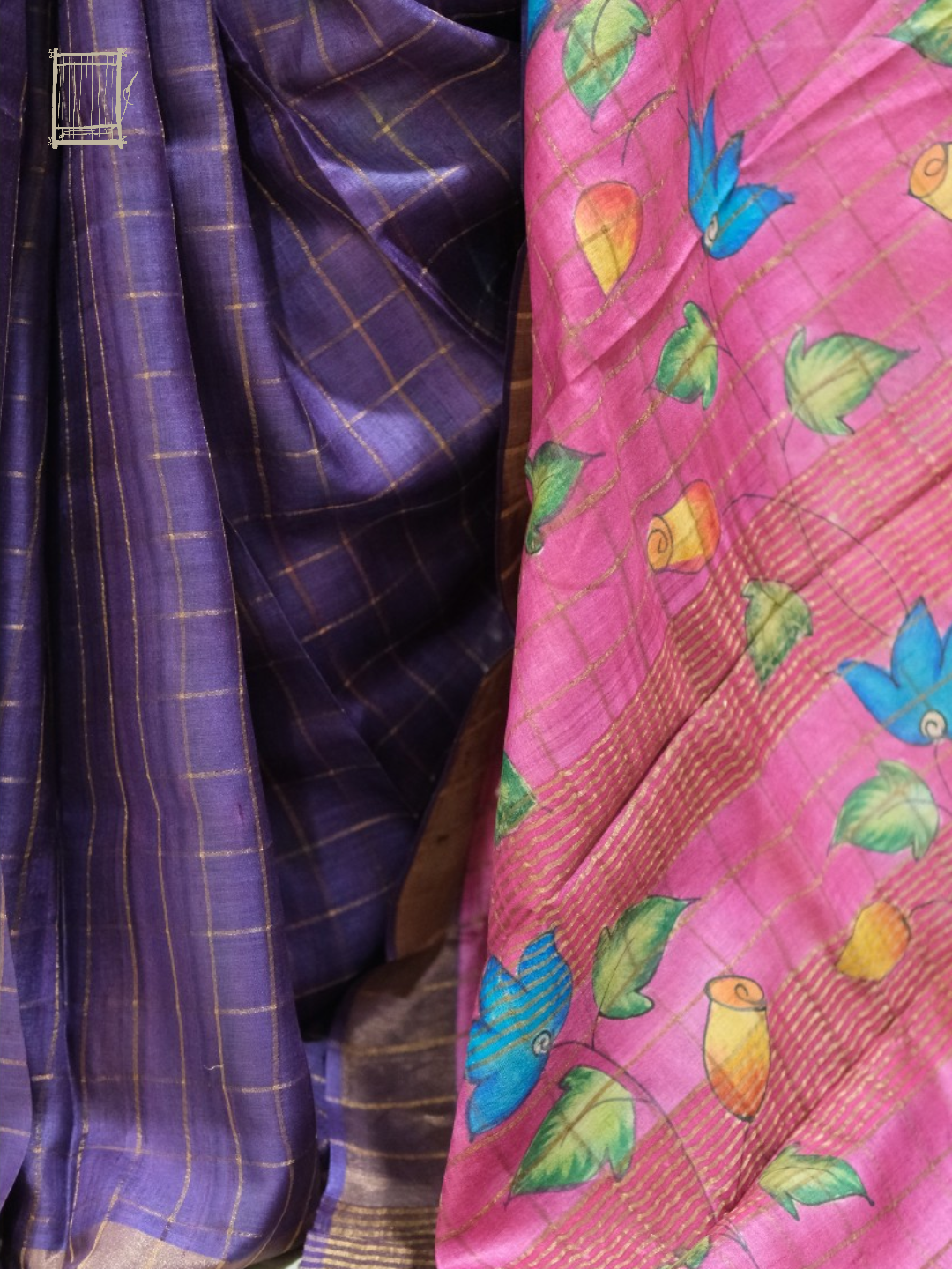 Pleats and pallu — dusty violet pleats falling beside magenta kalamkari with blue lotus